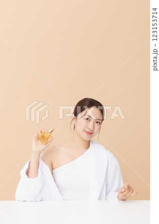 Portrait of beautiful young woman posing with oil Portrait of beautiful young woman posing with oil 123153714