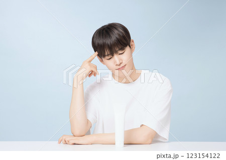 A young man demonstrating basic men's cosmetics 123154122