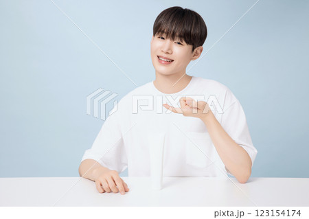 A young man demonstrating basic men's cosmetics 123154174