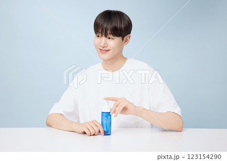 A young man demonstrating basic men's cosmetics 123154290