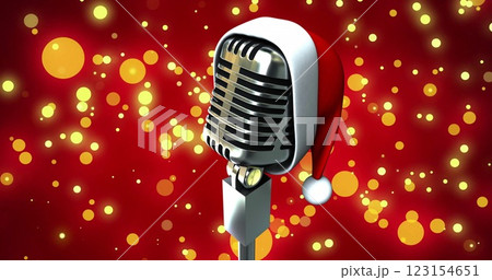 Image of microphone with santa hat over yellow spots 123154651