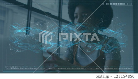 Image of financial data processing over african american businesswoman using laptop Image of financial data processing over african american businesswoman using laptop 123154850