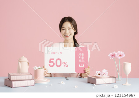 A woman in her 20s holding a coupon A woman in her 20s holding a coupon 123154967