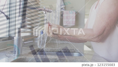 Image of financial data processing over senior caucasian woman washing hands 123155083