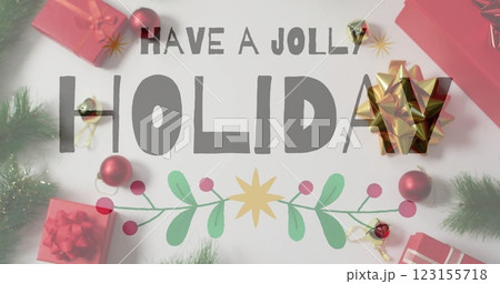 Have jolly holiday text image over Christmas decorations with gifts and ornaments Have jolly holiday text image over Christmas decorations with gifts and ornaments 123155718