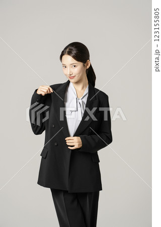 A woman in her 20s wearing a suit who successfully found a job 123155805