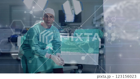 Image of data processing with molecules and brains over caucasian male surgeon in hospital Image of data processing with molecules and brains over caucasian male surgeon in hospital 123156023