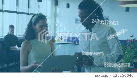 Business data processing image over diverse colleagues discussing work in office 123156046