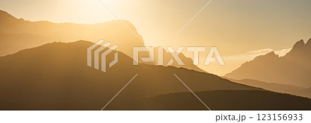 mountains silhouettes in sunset light, banner. Golden hour, natural landscape with tonal perspective 123156933
