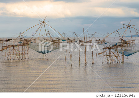 The beauty of the giant trap used by fishermen to catch fish in the Thale Noi freshwater lake, Pak Pra, Phatthalung The beauty of the giant trap used by fishermen to catch fish in the Thale Noi freshwater lake, Pak Pra, Phatthalung 123156945