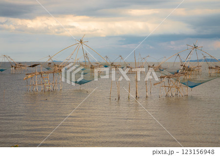 The beauty of the giant trap used by fishermen to catch fish in the Thale Noi freshwater lake, Pak Pra, Phatthalung The beauty of the giant trap used by fishermen to catch fish in the Thale Noi freshwater lake, Pak Pra, Phatthalung 123156948