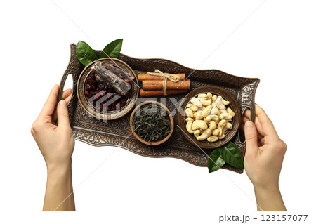 PNG, Ramadan. Female hands holding tray with traditional Ramadan food, isolated on white background. PNG, Ramadan. Female hands holding tray with traditional Ramadan food, isolated on white background. 123157077