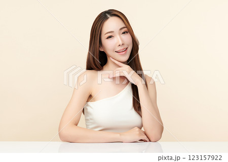 Beautiful young asian woman with clean fresh skin on beige background, Face care, Facial treatment, Cosmetology, beauty and spa, Asian women portrait. Beautiful young asian woman with clean fresh skin on beige background, Face care, Facial treatment, Cosmetology, beauty and spa, Asian women portrait. 123157922