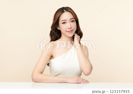 Beautiful young asian woman with clean fresh skin on beige background, Face care, Facial treatment, Cosmetology, beauty and spa, Asian women portrait. 123157935