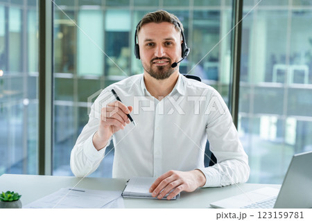 Professional Customer Service Agent Working in Modern Office with Headset Professional Customer Service Agent Working in Modern Office with Headset 123159781
