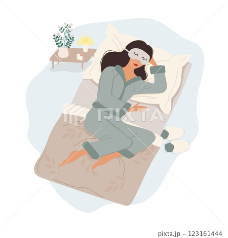 Woman sleeping in pajamas with sleep mask, isolated on white background 123161444