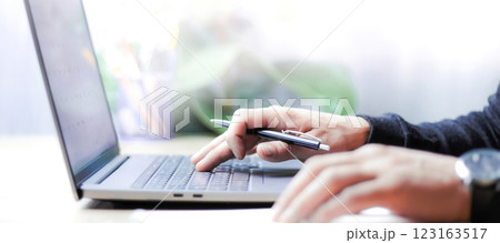 doing accounting on a laptop, doing business online, doing business from home, hand typing on laptop doing accounting on a laptop, doing business online, doing business from home, hand typing on laptop 123163517