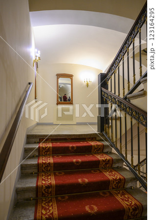 Staircase with carpet and railings in 19th century Alexandrian Theater in St. Petersburg, Russia 123164295