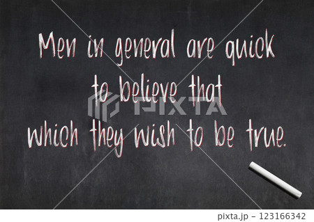 Quote from Julius Caesar about confirmation bias written on a blackboard 123166342