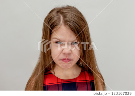 Squeamish caucasian child of 6 7 years on white background Squeamish caucasian child of 6 7 years on white background 123167029