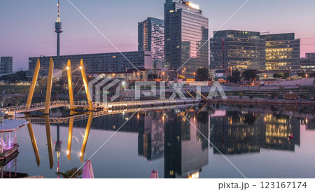 Donaustadt Danube City night to day timelapse is a modern quarter with skyscrapers and business centres in Vienna, Austria. 123167174