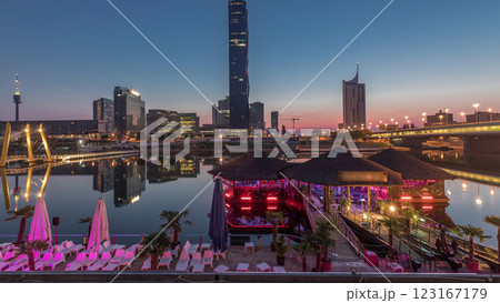 Donaustadt Danube City night to day timelapse is a modern quarter with skyscrapers and business centres in Vienna, Austria. Donaustadt Danube City night to day timelapse is a modern quarter with skyscrapers and business centres in Vienna, Austria. 123167179