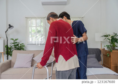 Compassionate nurse supporting elderly man with walker in cozy home setting. Compassionate nurse supporting elderly man with walker in cozy home setting. 123167680