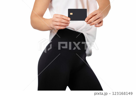 female handshowing black premium credit bank card on white background. credit card for online payment female handshowing black premium credit bank card on white background. credit card for online payment 123168149