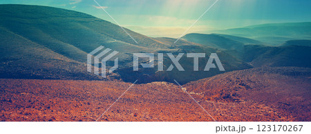 Evening cloudy sky over mountain desert. Negev desert in Israel at sunset. Horizontal banner Evening cloudy sky over mountain desert. Negev desert in Israel at sunset. Horizontal banner 123170267
