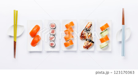 Assorted sushi and maki rolls beautifully arranged on plates 123170363