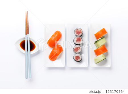 Assorted sushi and maki rolls beautifully arranged on plates 123170364