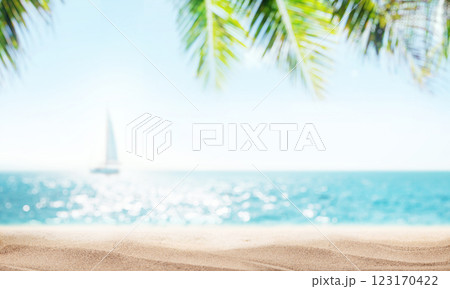 A serene seaside view with soft-focus palm leaves in the foreground and a sailboat gently gliding on the horizon A serene seaside view with soft-focus palm leaves in the foreground and a sailboat gently gliding on the horizon 123170422