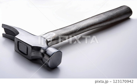 a modern claw hammer with a polished steel head and a smooth wooden handle, construction, carpentry, DIY projects, and professional tools, hammer is reflective metal surface 123170942