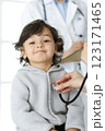 Woman-doctor examining a child patient by stethoscope. Cute arab toddler at physician appointment. Medicine concept 123171465
