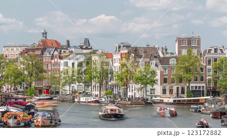 Timelapse of a busy river in Amsterdam's city center on a sunny day. Amsterdam, Netherlands Timelapse of a busy river in Amsterdam's city center on a sunny day. Amsterdam, Netherlands 123172882