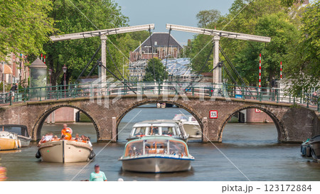Timelapse of a busy canal boat trip in Amsterdam's city center on a sunny day. Amsterdam, Netherlands Timelapse of a busy canal boat trip in Amsterdam's city center on a sunny day. Amsterdam, Netherlands 123172884