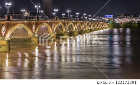 Pont de Pierre stone bridge with Porte de Bourgogne night timelapse in Bordeaux, France. 123172891