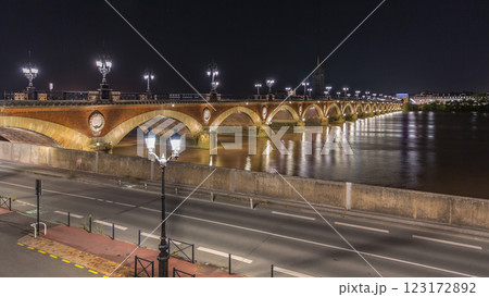 Pont de Pierre stone bridge with Porte de Bourgogne night timelapse in Bordeaux, France. 123172892
