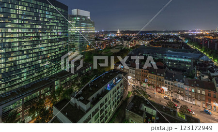 Aerial night timelapse of Brussels urban landscape blending office skyscrapers with residential areas. 123172949
