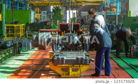 Conveyor assembly stage the body of tractor at big industrial factory timelapse Conveyor assembly stage the body of tractor at big industrial factory timelapse 123173028