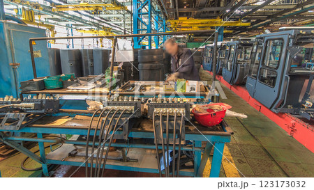 Conveyor assembly stage the body of tractor at big industrial factory timelapse 123173032