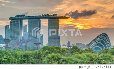 Marina Bay Sands, Gardens by the bay with cloud forest, flower dome and supertrees at sunset timelapse 123173134