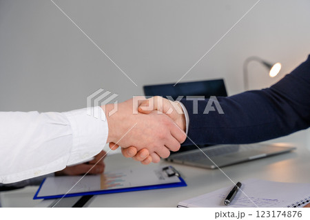 Professional Handshake Between Two Businesspeople in an Office Environment Professional Handshake Between Two Businesspeople in an Office Environment 123174876