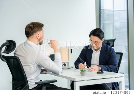 Professional Business Meeting in a Modern Office Environment with Focused Discussion 123174895