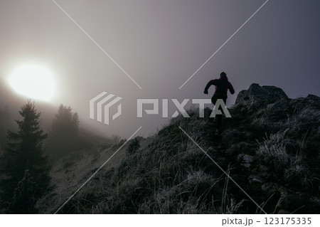 Trail Runner in Misty Mountain Landscape Trail Runner in Misty Mountain Landscape 123175335