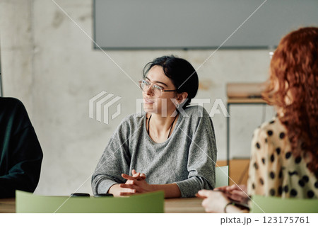 A diverse multiethnic business team engages in a collaborative meeting, discussing strategies and solutions in a modern office setting A diverse multiethnic business team engages in a collaborative meeting, discussing strategies and solutions in a modern office setting 123175761