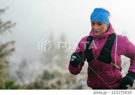 Trail Runner in Misty Mountain Landscape 123175810