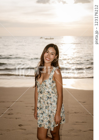 Portrait of young woman on the beach Portrait of young woman on the beach 123176212