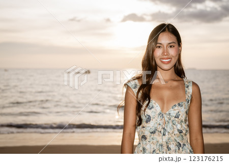 Portrait of young woman on the beach 123176215