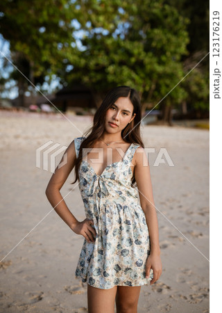 Portrait of young woman on the beach Portrait of young woman on the beach 123176219